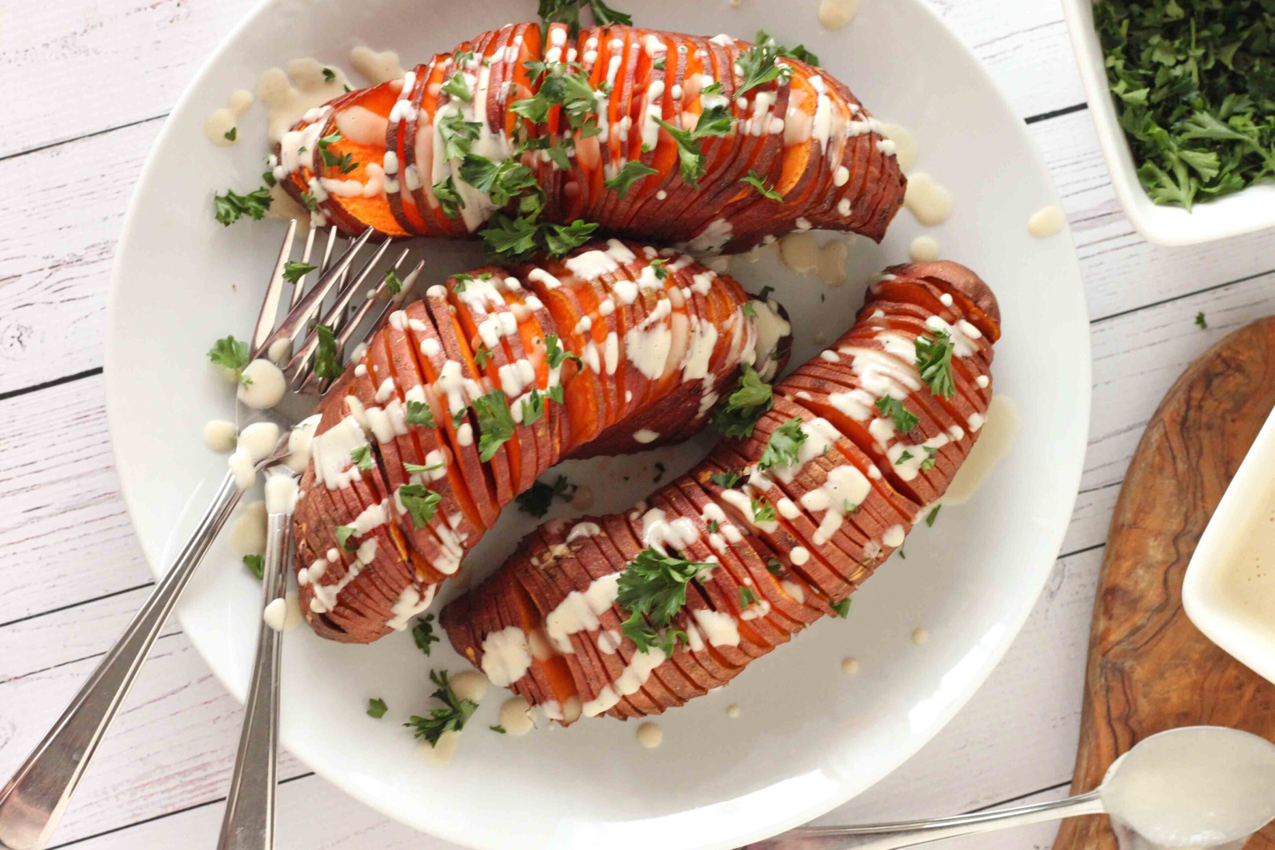 Hasselback Sweet Potatoes with Roasted Garlic Sauce by Jesse Lane Lee