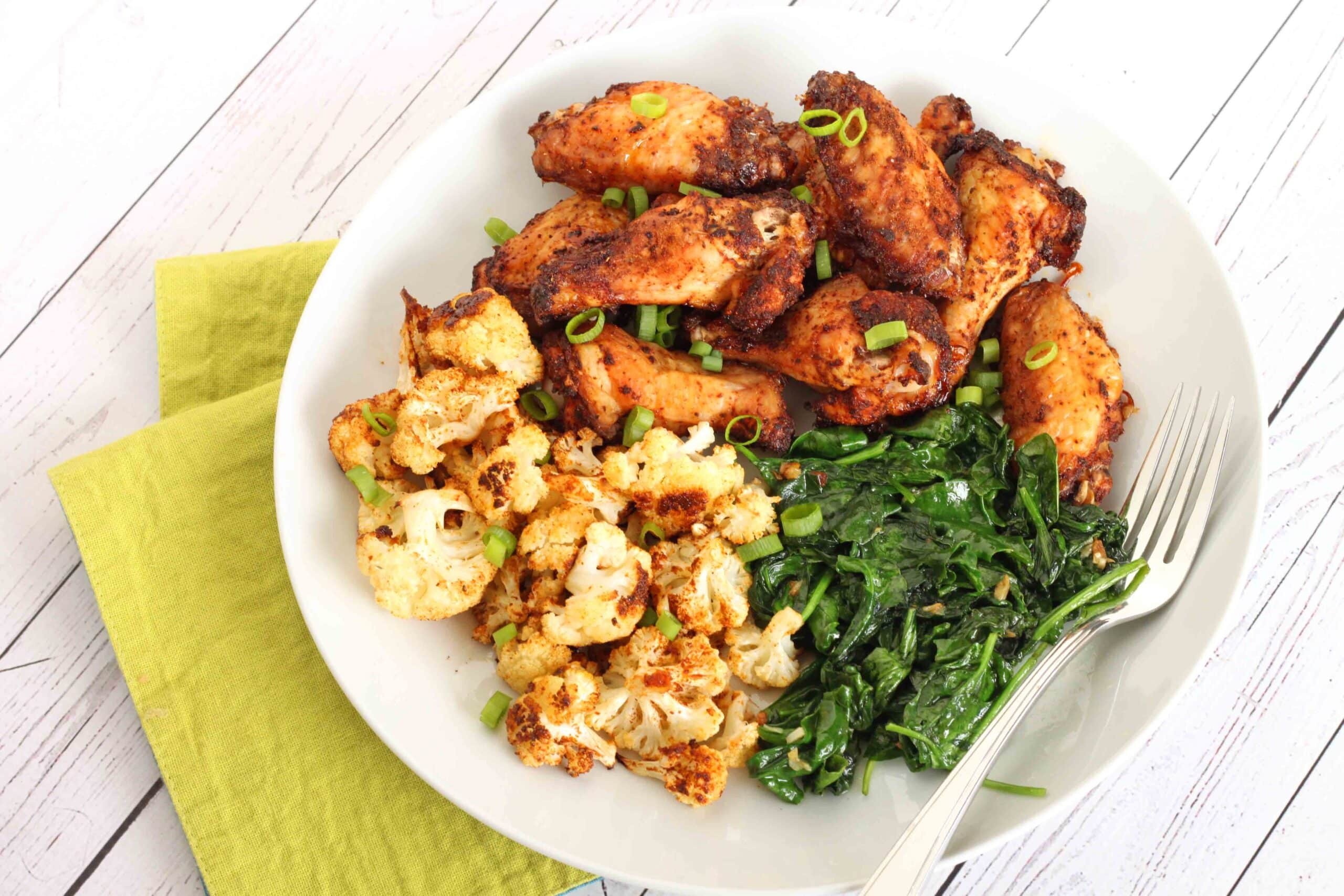 Dry-Rub Chicken Wings with Roasted Cauliflower and Garlic Spinach Recipe