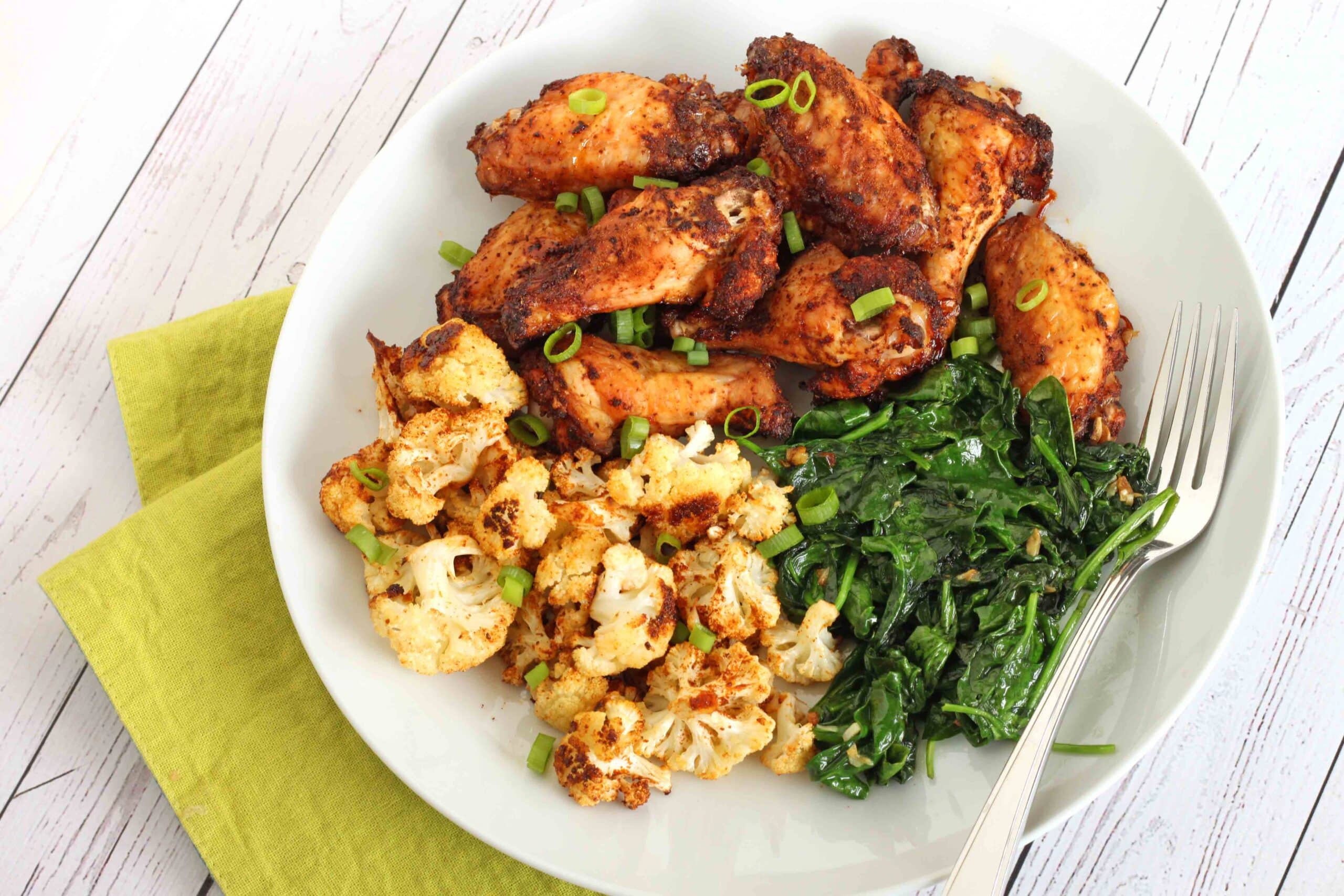 Dry-Rub Chicken Wings with Roasted Cauliflower and Garlic Spinach Recipe