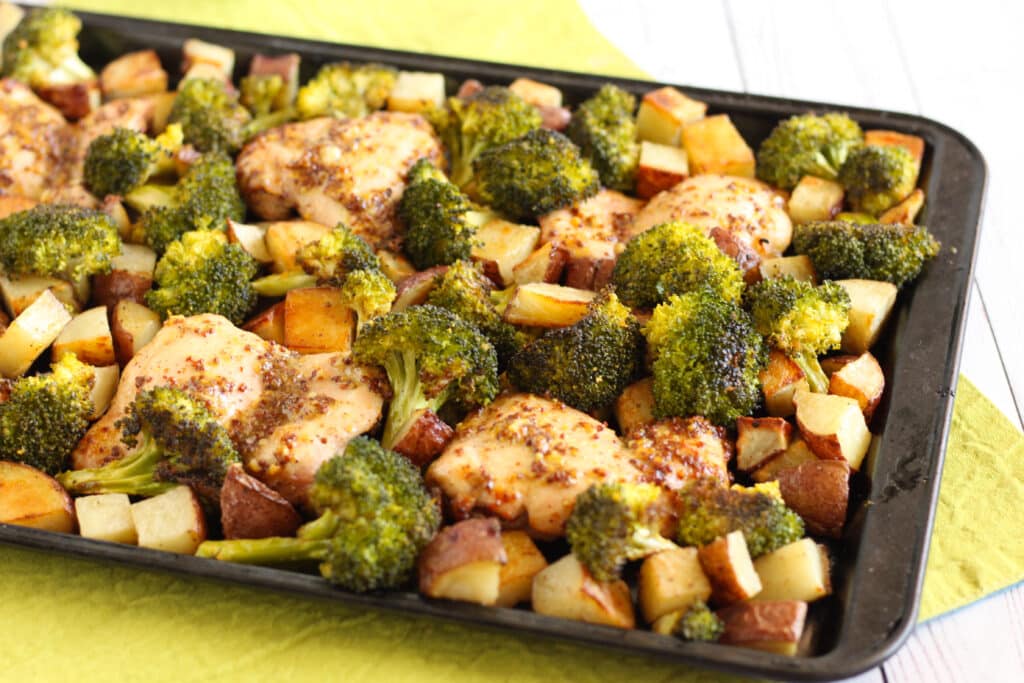 Honey Mustard Sheet Pan Chicken Thighs and New Potatoes with Roasted Broccoli by Jesse Lane Wellness