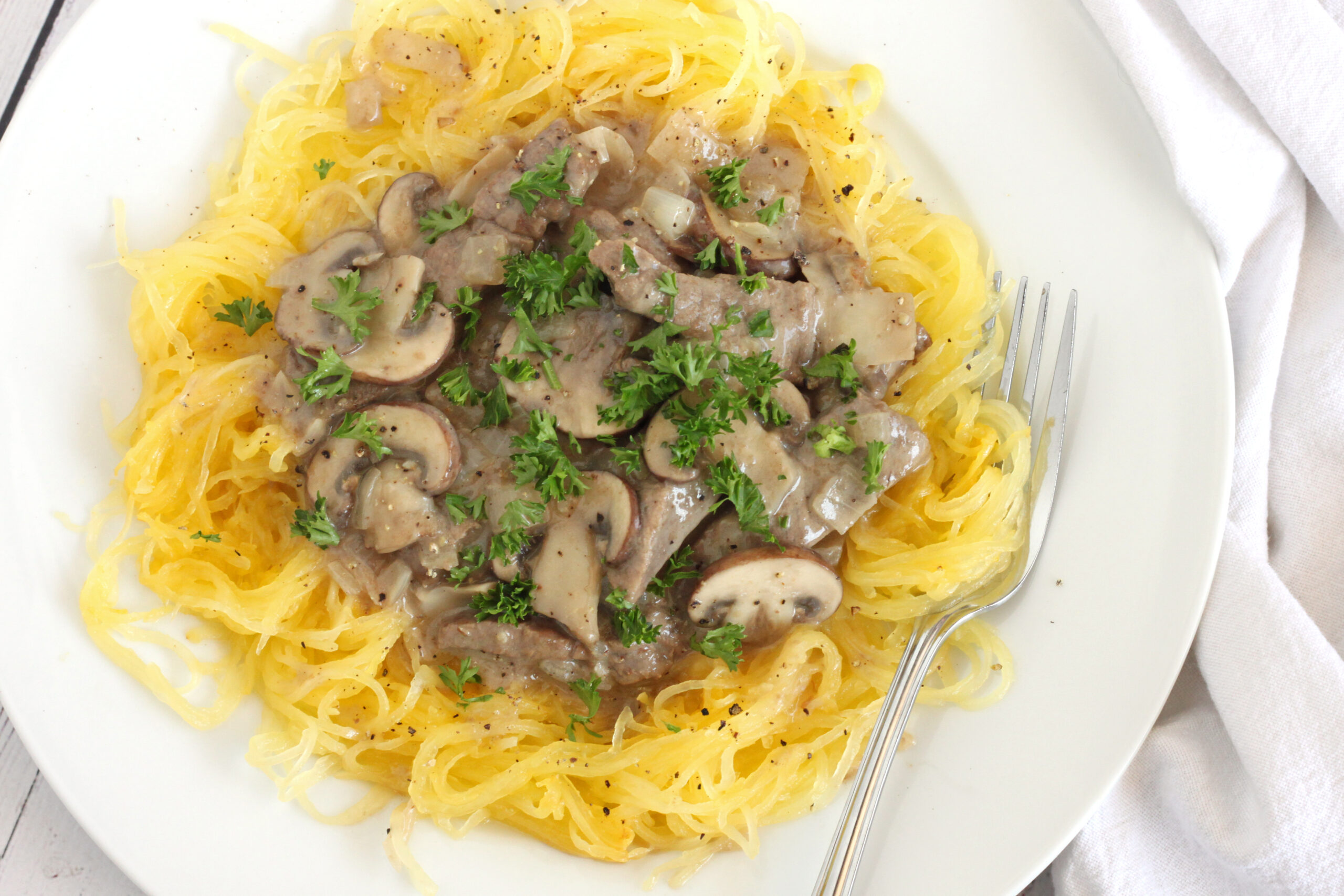 Creamy Paleo Spaghetti Squash Beef Stroganoff by Jesse Lane Wellness